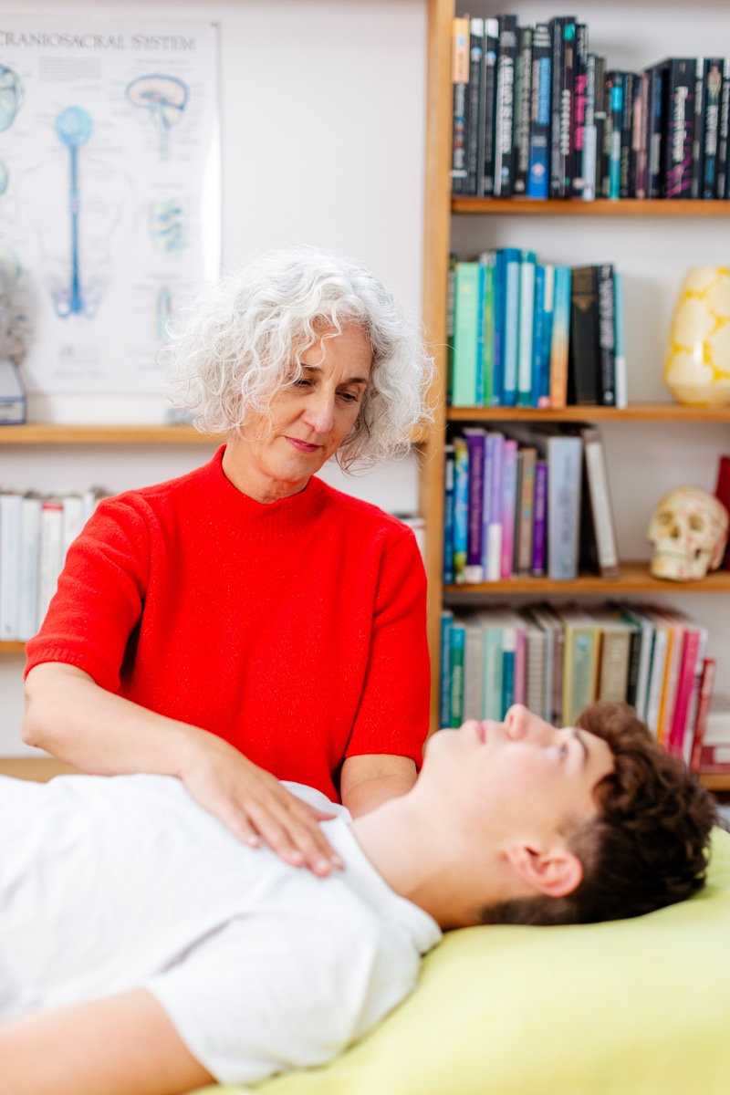 Caroline Barrow performing a CranioSacral Therapy session